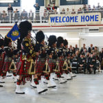 (360) Vancouver Police Pipe Band under the Welcome Home banner.
