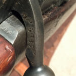 Inspector's marks on top of body on each side of the bolt.