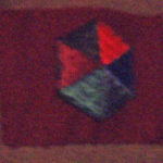 Formation patches on the greatcoat of Major General Bert Hoffmesiter. The maroon rectangle ifs 5th Canadian Armoured Division (nicknamed "Hoffy's Mighty Maroon Machine") and the multicoloured patch shows that he volunteeredfor the Canadian Army Pacific Force to fight the Japanese.