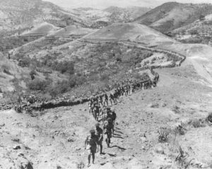 Lieutenant Colonel Bert Hoffmeister leads the Seaforth Highlanders of Canada to a brigade inspection by General Montgomery. Militello, Sicily, 1943.