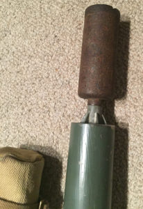 2-INCH MORTAR with INERT practice bomb projecting out of muzzle.