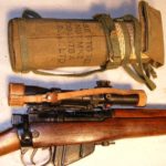 1931 Lee-Enfield No. 4 MK. I (T) TRIALS F.T.R., matching in-service No. 32 MKL.3 scope SN 25455 and remained in service until 1963. - Rifle and matching scope case.