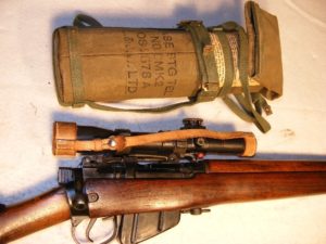 1931 Lee-Enfield No. 4 MK. I (T) TRIALS F.T.R., matching in-service No. 32 MKL.3 scope SN 25455 and remained in service until 1963. - Rifle and matching scope case.