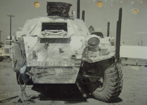 View of front of a Ferret Scout Car after a mine blew the front right wheel off.