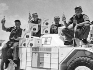 Soldiers in Ferret UNEF1209 loading cases of Carling beer onto their Ferret. (RCD Archives)