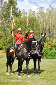 Two Mounties on horseback.