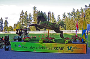 Burnaby parade float with carousel horse covered in living plants. (?)(D90 074)