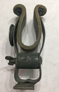A rare original WWII SAS, Airborne or LRDG weapons clip for jeep as mounted on a front fender. Made from a converted British bicycle weapons clip. 