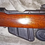 Second rifle which has no serial number. Left side with wood furniture in place.