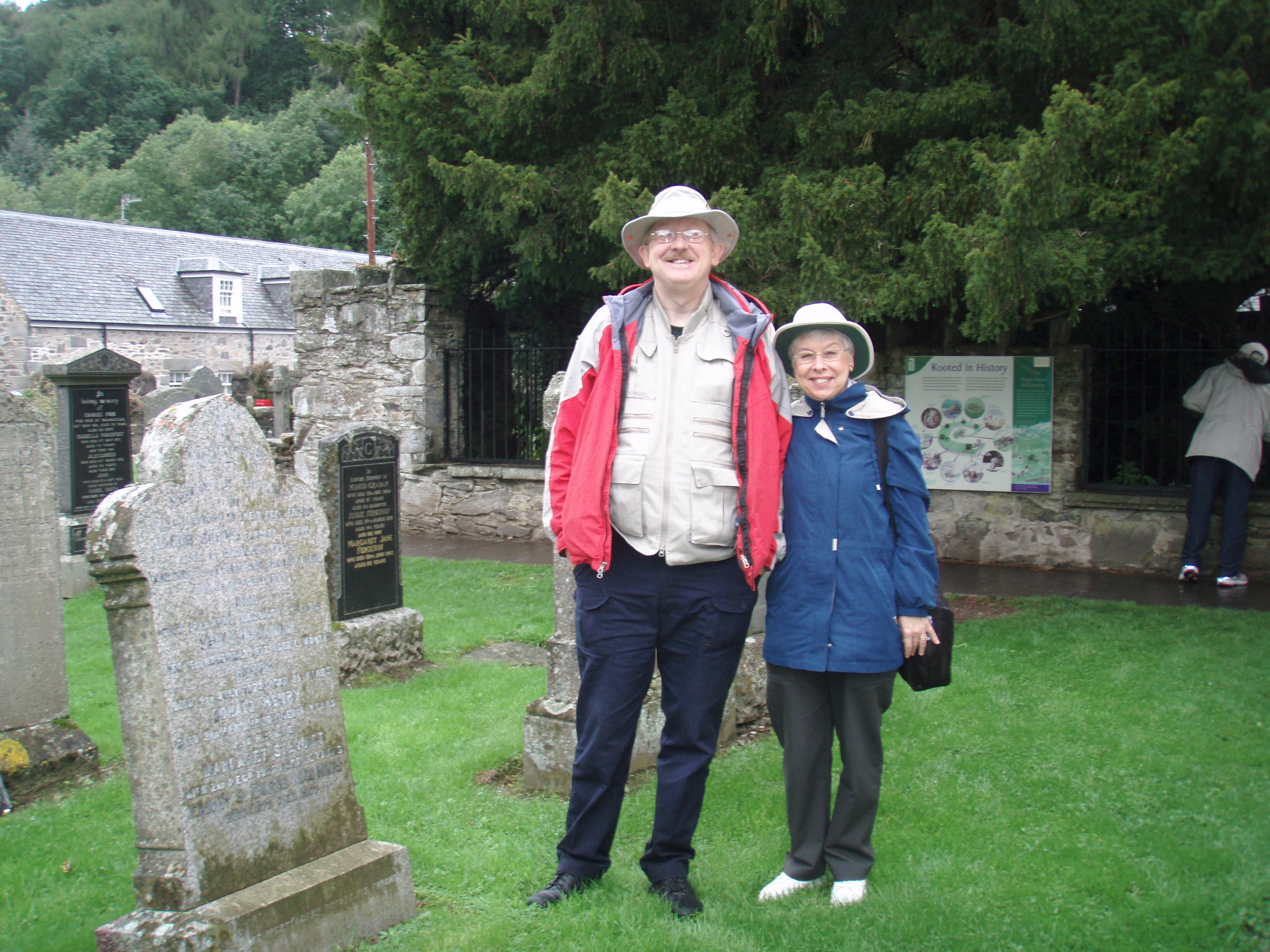 Colin & Jeanette Stevens in Fortingall church yard in front of the ancient yew tree.