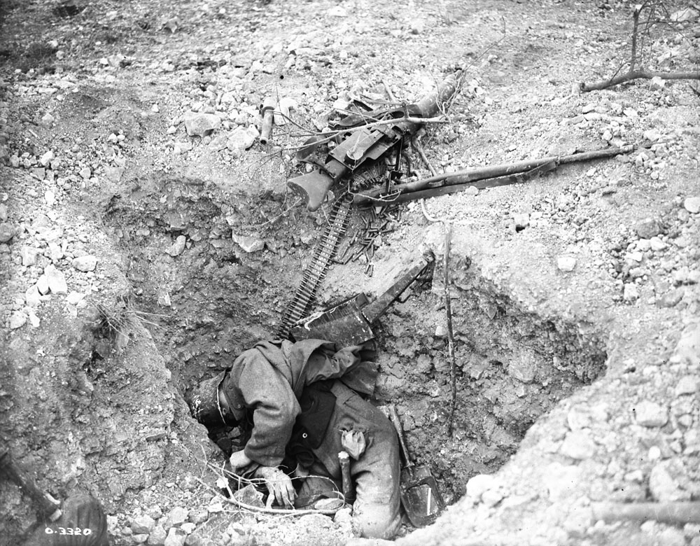 Photo O.2542 M.G. 08/15 Dead gunner. He was killed trying to stop the Canadian advance. Canal du Nord East of Arras November 1918