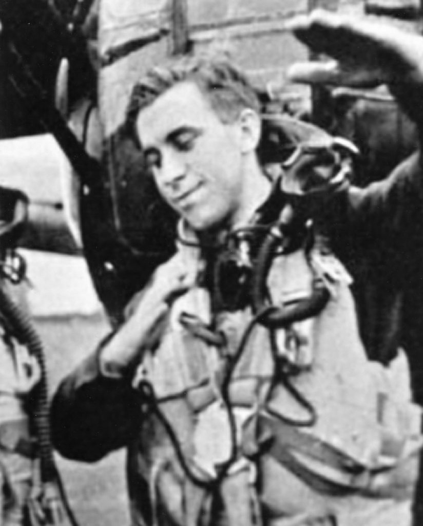 J. W. "Junior" Cumbers, air-gunner, shows how he shot down a FW-190 & Me109. 