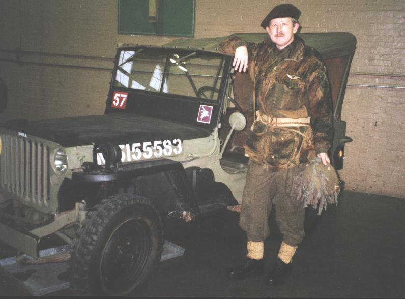 Colin Stevens with his Willys MB ex-British Airborne (1 AB Div probably post-Arnhem replacement) painted for 1 Canadian Parachute Battalion . The canvas top was not painted black as it is an original British issue one. At Beatty Street Drill Hall, Vancouver, B.C. , Canada.