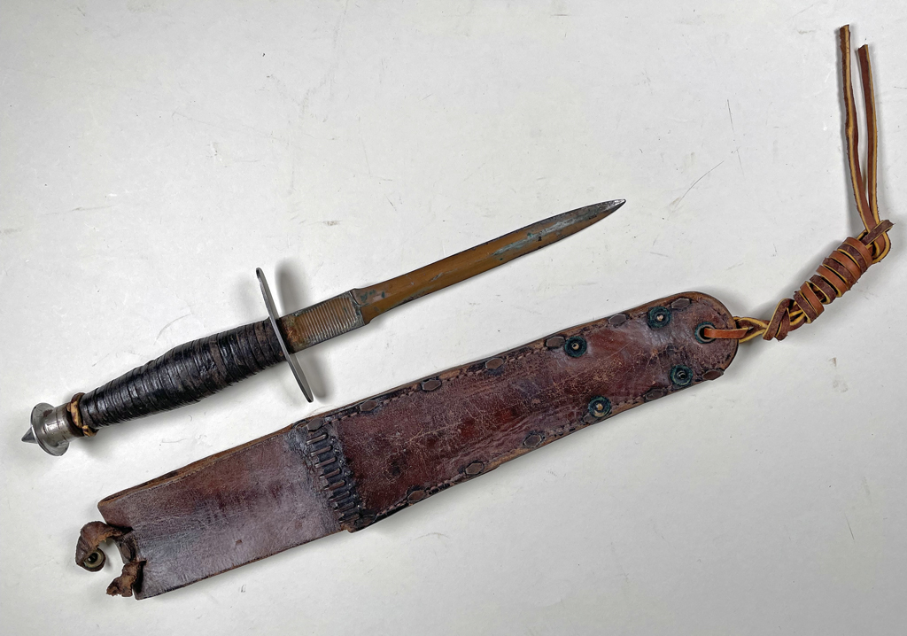 V-42 of known Sgt 1-1 FSSF man who was awarded the Silver Star for bravery at Anzio. - Front view, scabbard folded.