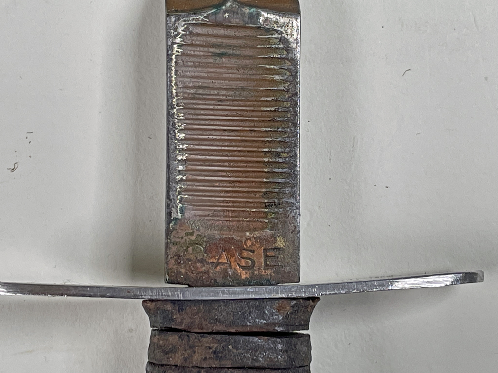 V-42 of known Sgt 1-1 FSSF man who was awarded the Silver Star for bravery at Anzio. - Front view, scabbard folded. Maker CASE name and thumbprint.