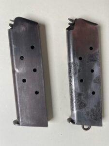 Twin magazine pouch C/|\  issue and two Colt magazines 