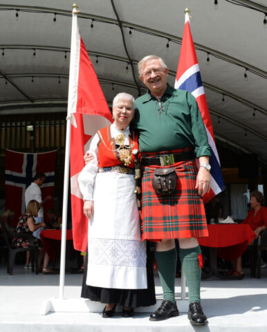 Jeanette and Colin Stevens in 2019. Jeanette in Norwegian Hardanger pattern bunad and Colin in MacGregor tartan kilt. Jeanette and Colin Stevens in 2019