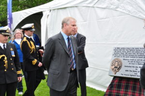 Victoria Highland Games 2013 150th (134) - HRH Prince Andrew reading plaque fore the 150th Anniversary that he had just unveiled.