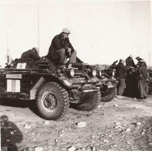 McNicholl Ferret photos - 54-82585 UNEF 1215 likely - man sitting on top green