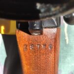 L42A1 showing scope serial number stamped on wrist of the butt. The WWII inspection markings to right of bolt are partyl visible.