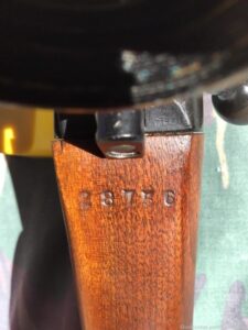 L42A1 showing scope serial number stamped on wrist of the butt. The WWII inspection markings to right of bolt are partyl visible.