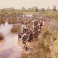 1976 BCR (DCO) M38A1 CDN3 71-09052 stuck during driver training on Sea Island, Richmond, BC. Note the tow cable and the shovel (in front of the licence plate). - Manfred Harder 1976 BCR (DCO) M38A1 CDN3 71-09052 stuck during driver training on Sea Island, Richmond, BC. Note the tow cable and the shovel (in front of the licence plate).