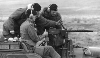 BCR (DCO) M38A1 CDN2 or CDN3 at gun camp, Yakima, WA, USA. Lieutenant Peters manning the gun. M38A1 CDN2 or 3 RECCE JEEP BCR working on GPMG April 1980 C42 radio stbd side camo
