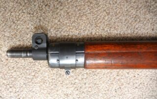 Long Branch 1941 with 1942 barrel all matching 1L314 - Left side view of "wasp waist" front sight protector and hinged upper band. Band has C/| marking.